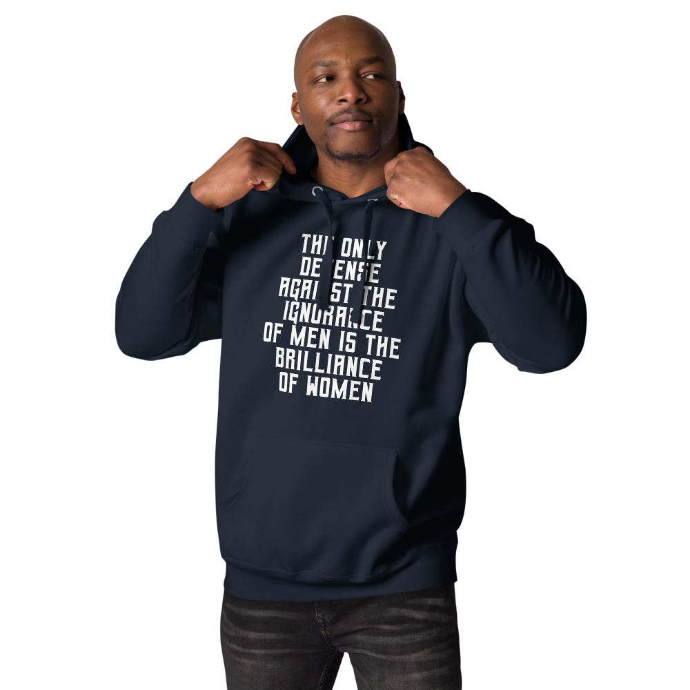 "The Only defense against the ignorance of men is the brilliance of women" printed on a navy blazer unisex hoodie worn by a male