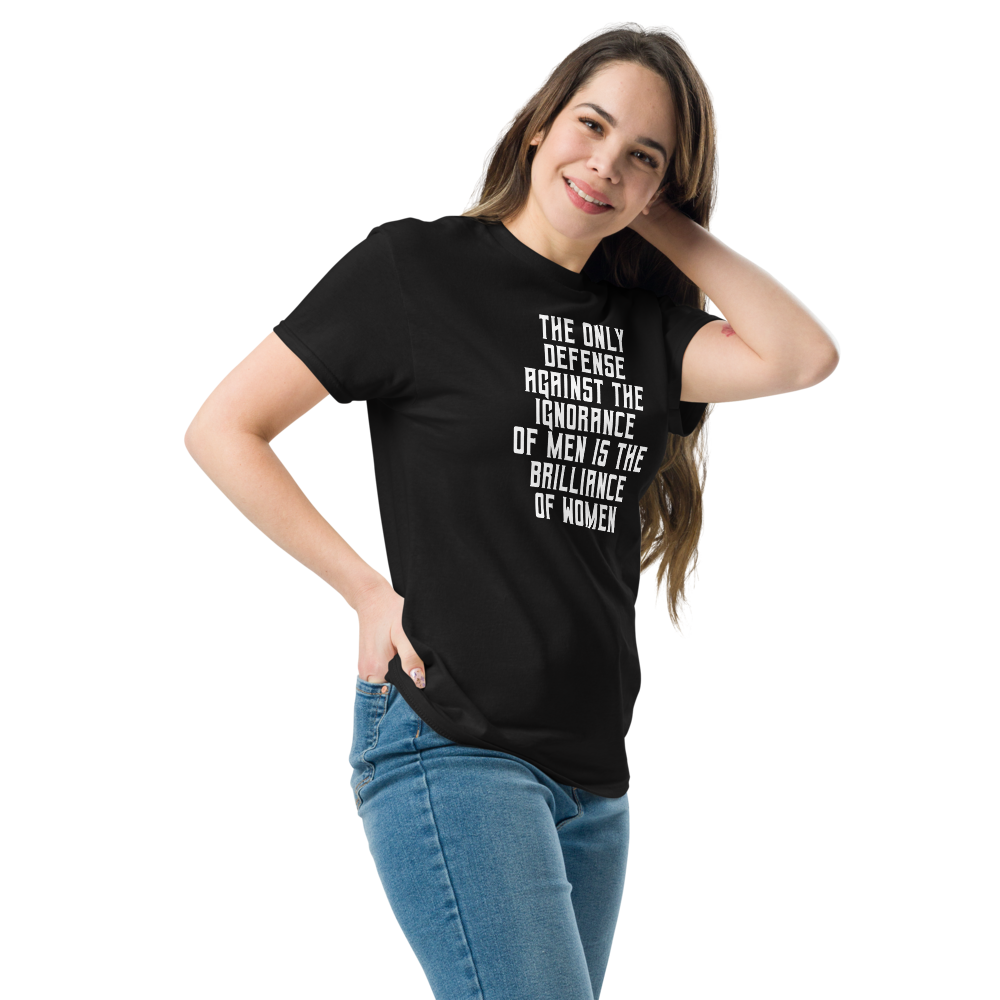 "The Only defense against the ignorance of men is the brilliance of women" printed on a black unisex classic tee worn by a female