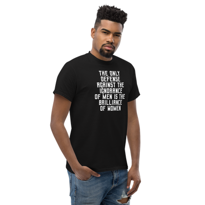 "The Only defense against the ignorance of men is the brilliance of women" printed on a black unisex classic tee worn by a male