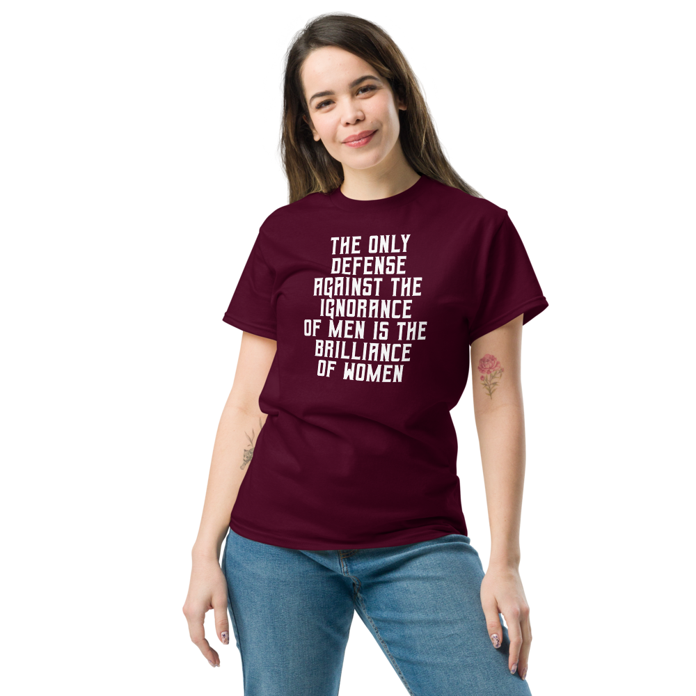 "The Only defense against the ignorance of men is the brilliance of women" printed on a maroon unisex classic tee worn by a female