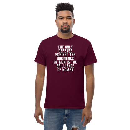 "The Only defense against the ignorance of men is the brilliance of women" printed on a maroon unisex classic tee worn by a male