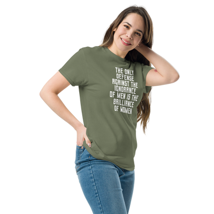 "The Only defense against the ignorance of men is the brilliance of women" printed on a military green unisex classic tee worn by a female