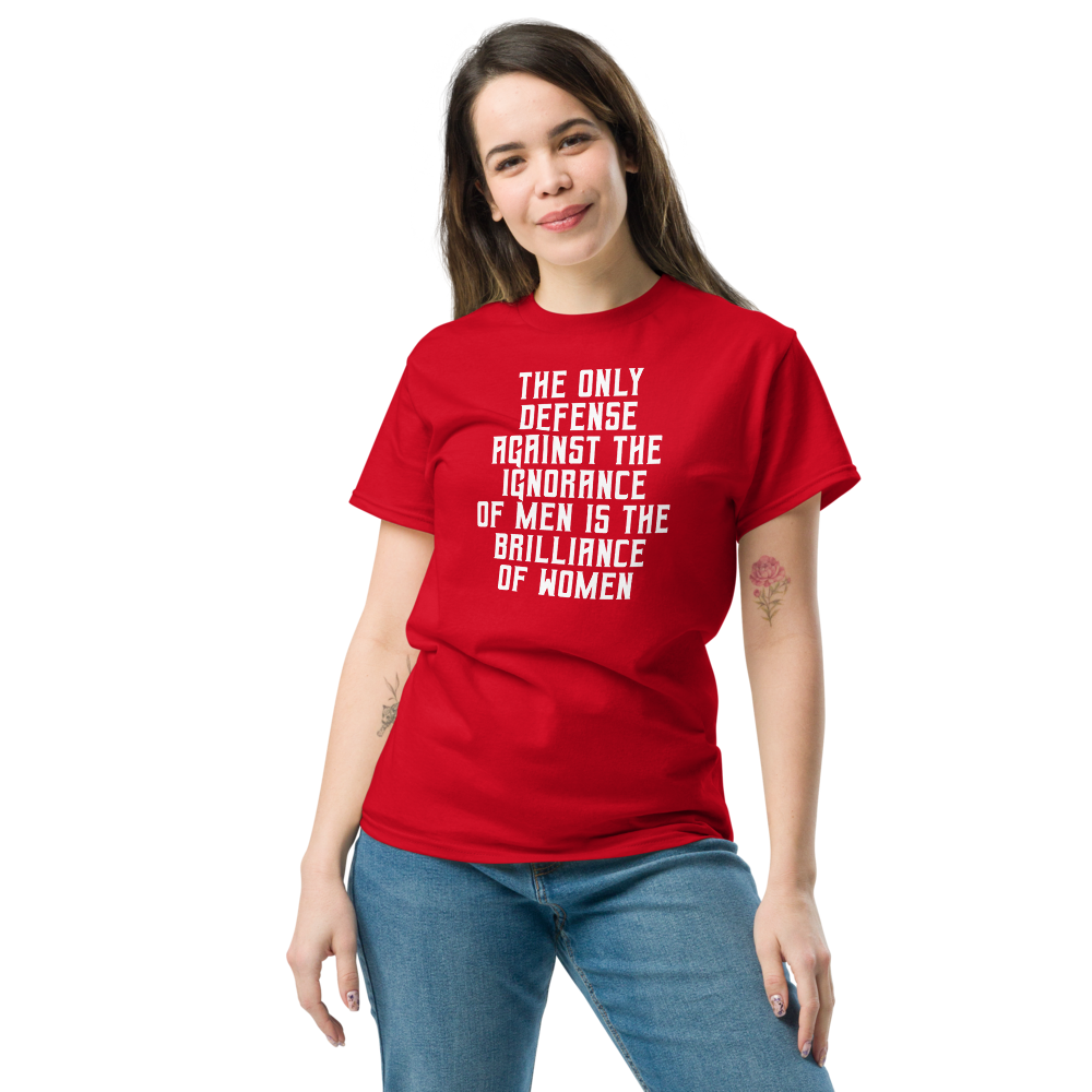 "The Only defense against the ignorance of men is the brilliance of women" printed on a red unisex classic tee worn by a female
