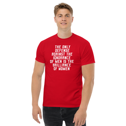 "The Only defense against the ignorance of men is the brilliance of women" printed on a red unisex classic tee worn by a male