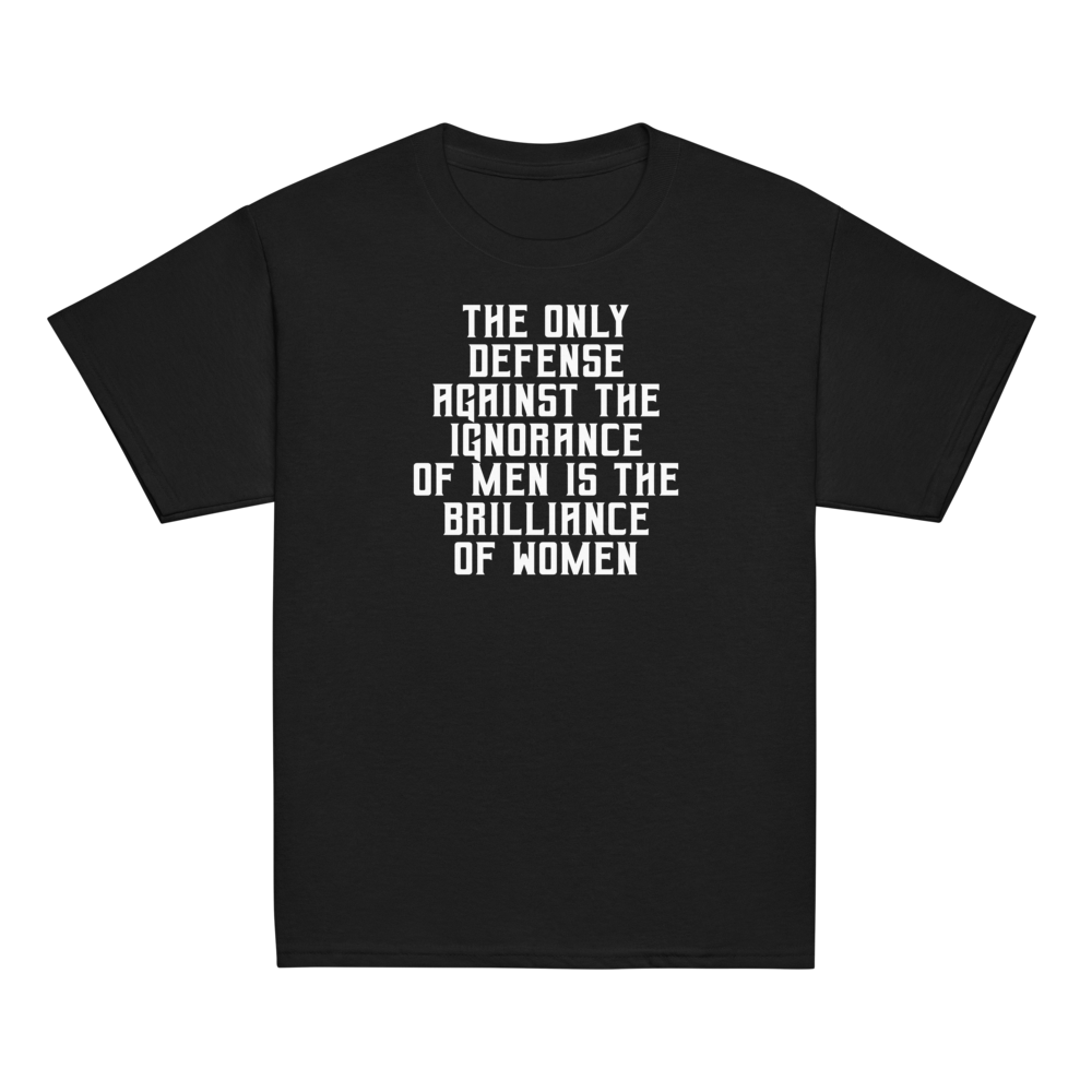 "The Only defense against the ignorance of men is the brilliance of women" printed on a black youth classic tee laying on a flat surface
