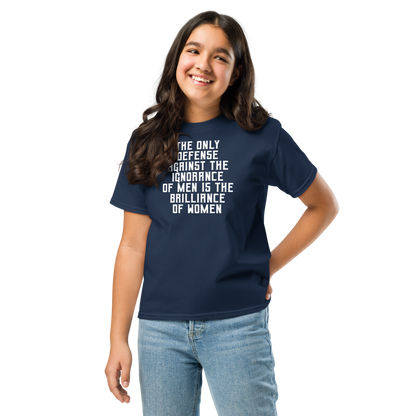 "The Only defense against the ignorance of men is the brilliance of women" printed on a navy youth classic tee worn by a female