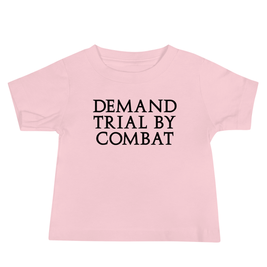 "Demand trial by combat" printed on a pink baby jersey short sleeve tee laying on a flat surface