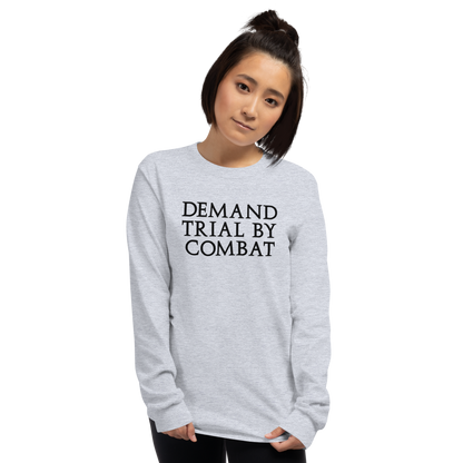 "Demand trial by combat" printed on a sport grey men's long sleeve shirt worn by a female
