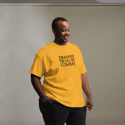 "Demand trial by combat" printed on a gold unisex classic tee worn by a male