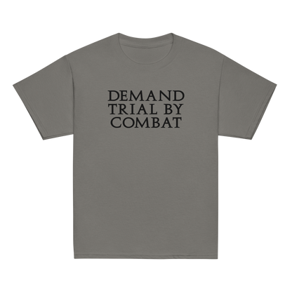 "Demand trial by combat" printed on a charcoal youth classic tee laying on a flat surface
