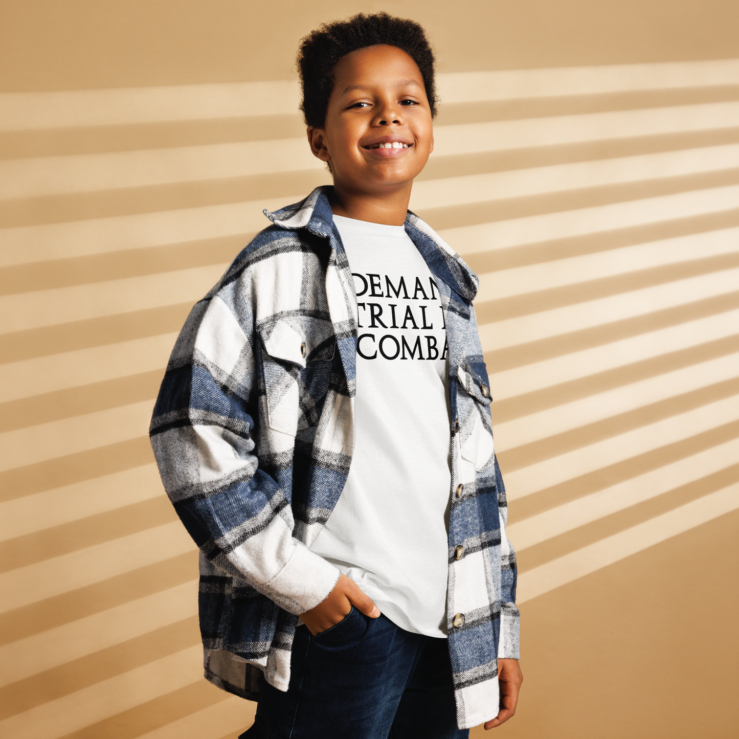 "Demand trial by combat" printed on a white youth classic tee worn by a male also wearing a jacket