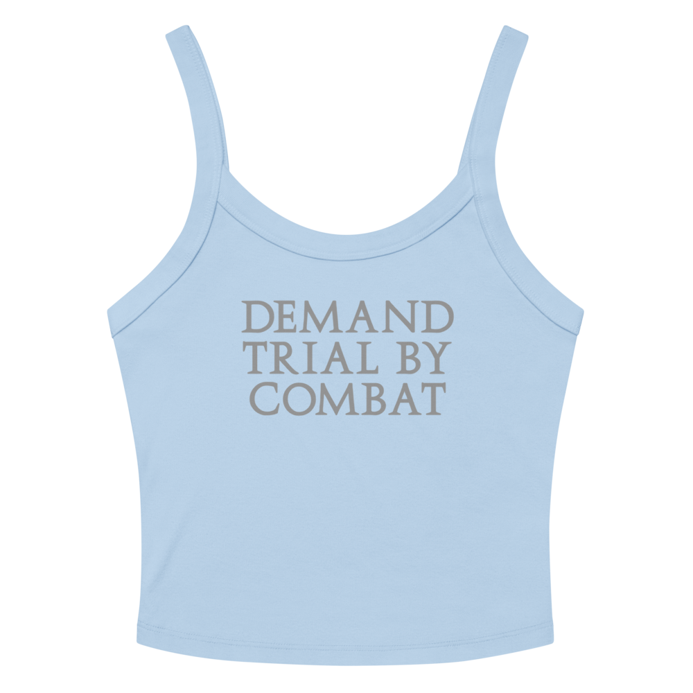 "Demand trial by combat" printed on a solid baby blue blend women's micro-rib tanktop laying on a flat surface amongst sunglasses and shorts