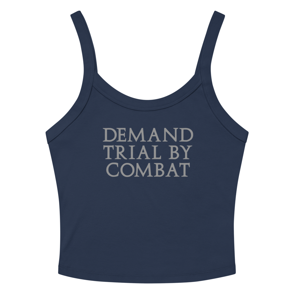 "Demand trial by combat" printed on a solid navy blend women's micro-rib tanktop laying on a flat surface amongst sunglasses and shorts