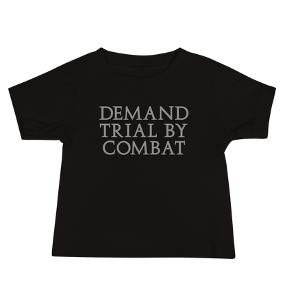 "Demand trial by combat" printed on a black baby jersey short sleeve tee laying on a flat surface