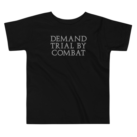 "Demand trial by combat" printed on a black toddler short sleeve tee laying on a flat surface