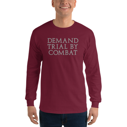 "Demand trial by combat" printed on a maroon men's long sleeve shirt worn by a male