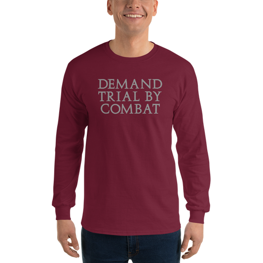 "Demand trial by combat" printed on a maroon men's long sleeve shirt worn by a male