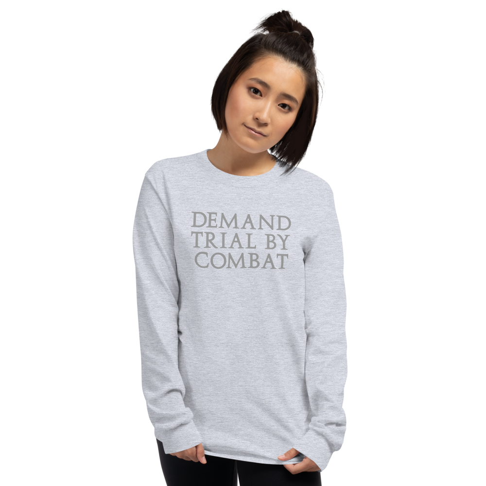 "Demand trial by combat" printed on a sport grey men's long sleeve shirt worn by a female