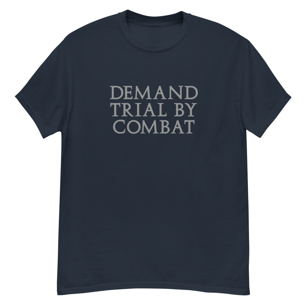 "Demand trial by combat" printed on a navy unisex classic tee laying on a flat surface