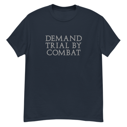 "Demand trial by combat" printed on a navy unisex classic tee laying on a flat surface