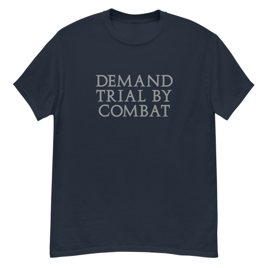 "Demand trial by combat" printed on a navy unisex classic tee laying on a flat surface