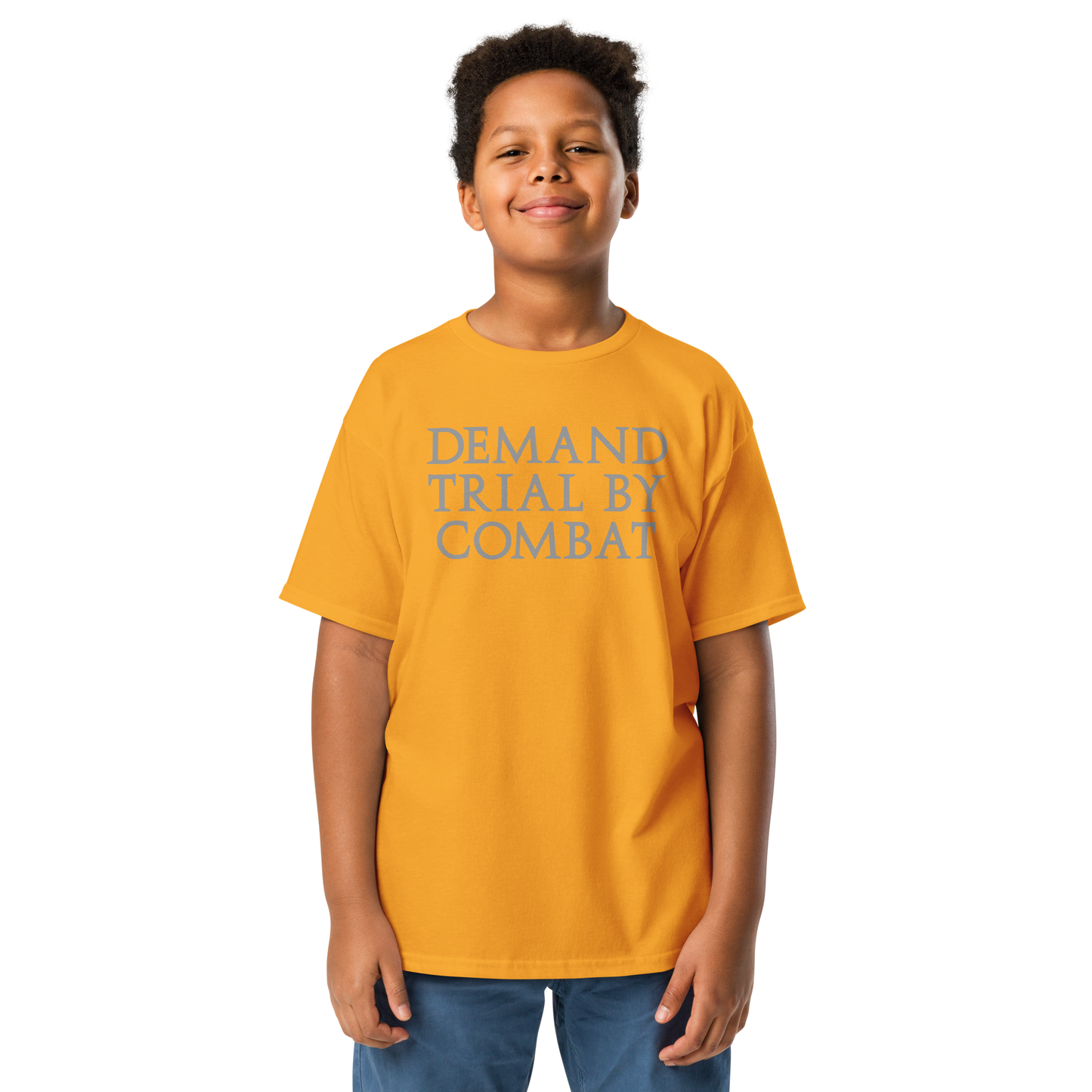 "Demand trial by combat" printed on a gold youth classic tee worn by a male