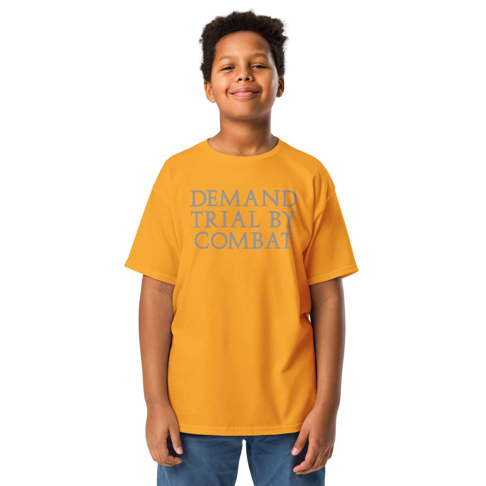 "Demand trial by combat" printed on a gold youth classic tee worn by a male