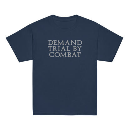 "Demand trial by combat" printed on a navy youth classic tee laying on a flat surface