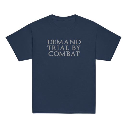 "Demand trial by combat" printed on a navy youth classic tee laying on a flat surface
