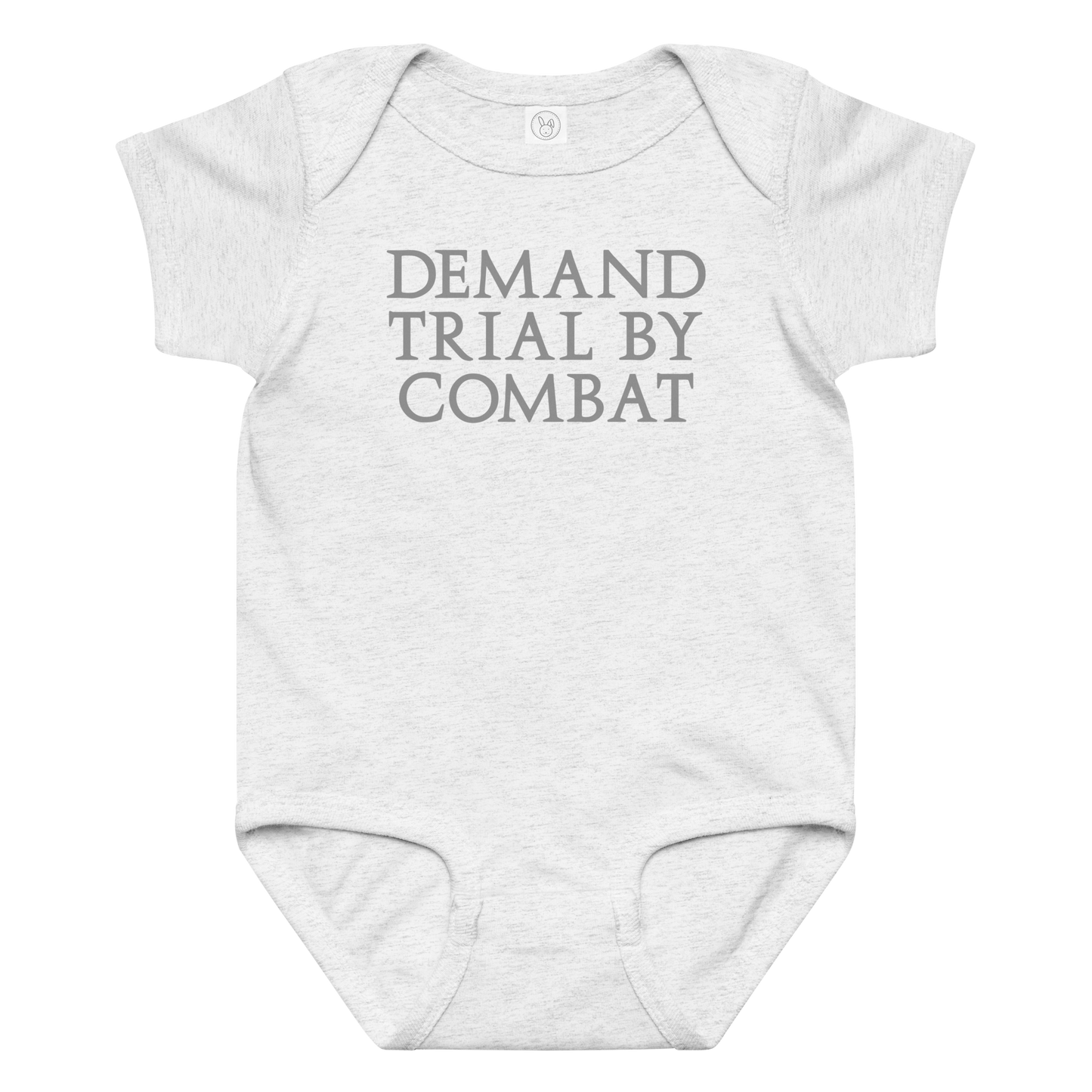"Demand trial by combat" printed on a ash baby jersey bodysuit laying on a flat surface amongst other clothes