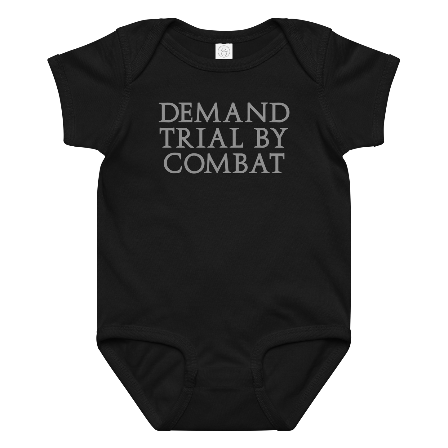 "Demand trial by combat" printed on a black baby jersey bodysuit laying on a flat surface amongst other clothes