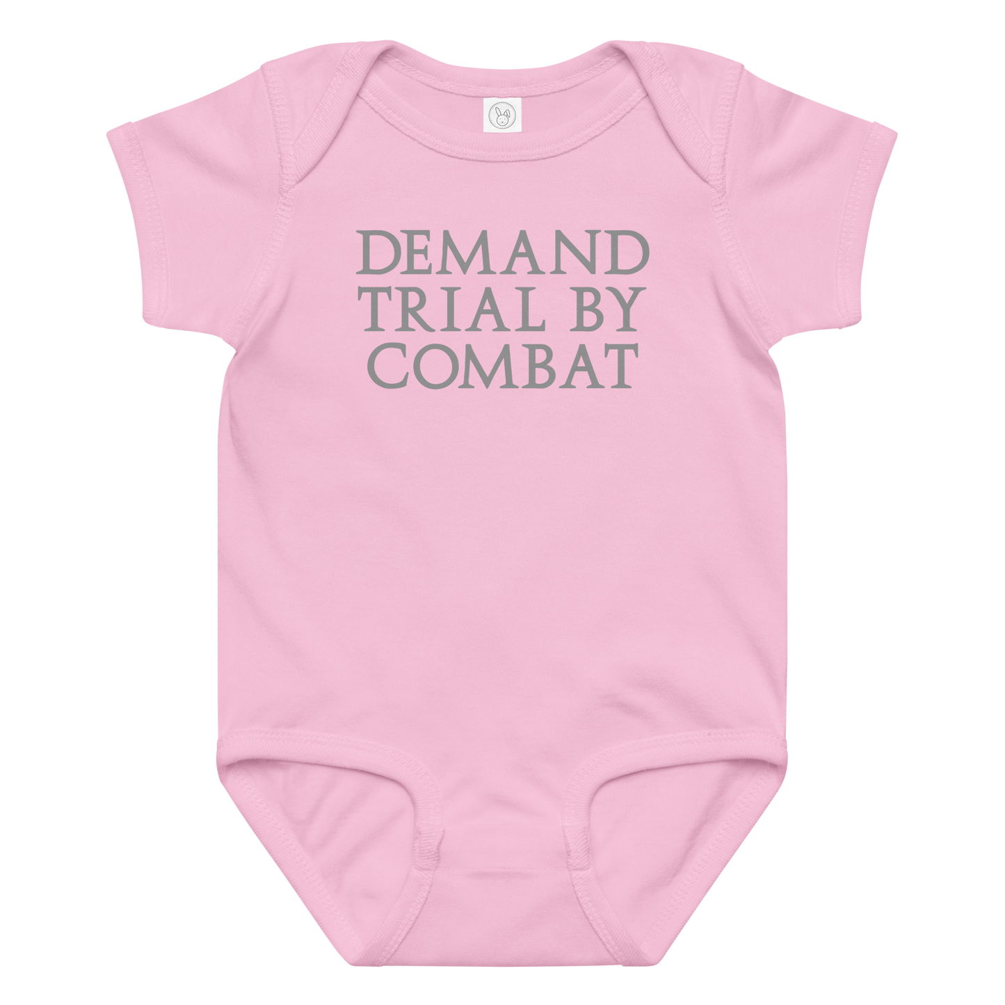 "Demand trial by combat" printed on a pink baby jersey bodysuit laying on a flat surface amongst other clothes