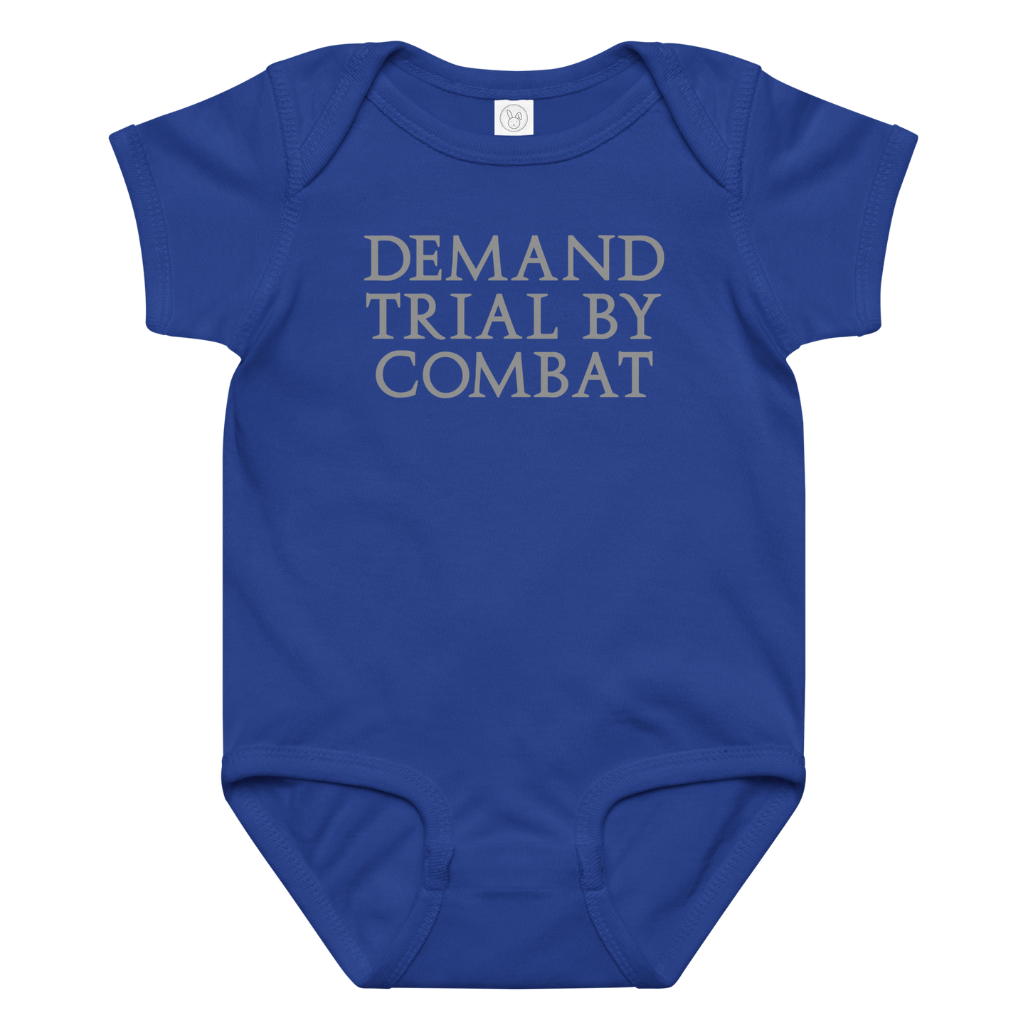 "Demand trial by combat" printed on a royal baby jersey bodysuit laying on a flat surface amongst other clothes