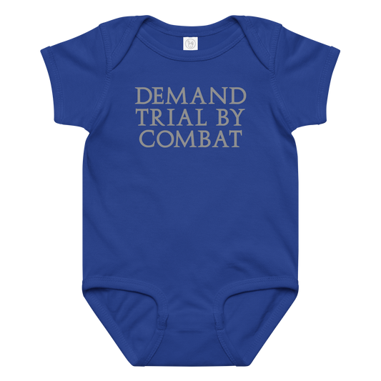 "Demand trial by combat" printed on a royal baby jersey bodysuit laying on a flat surface amongst other clothes