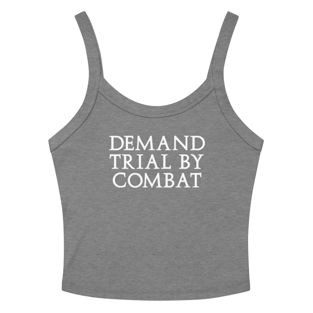 "Demand trial by combat" printed on a athletic heather women's micro-rib tanktop laying on a flat surface amongst sunglasses and shorts
