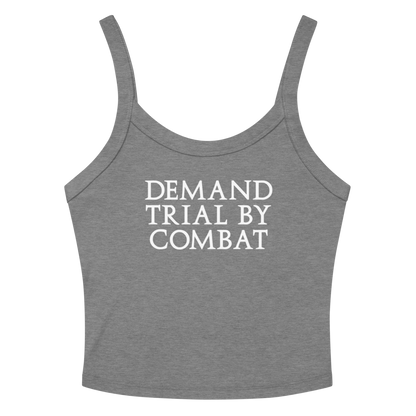 "Demand trial by combat" printed on a athletic heather women's micro-rib tanktop laying on a flat surface amongst sunglasses and shorts