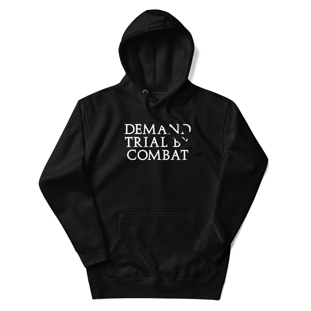 "Demand trial by combat" printed on a black unisex hoodie laying on a flat surface with the hood up