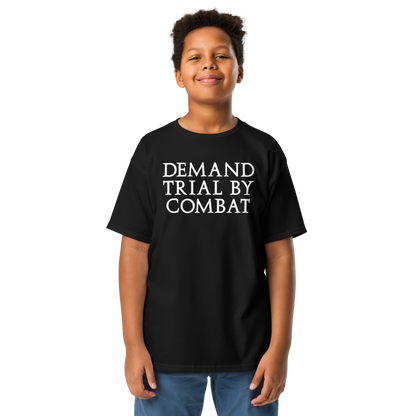 "Demand trial by combat" printed on a black youth classic tee worn by a male