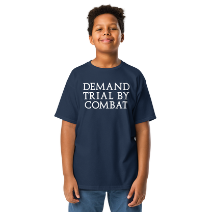 "Demand trial by combat" printed on a navy youth classic tee worn by a male