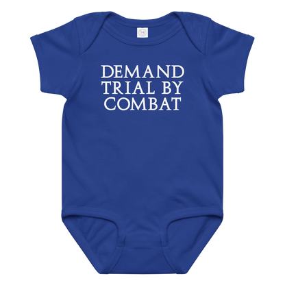 "Demand trial by combat" printed on a royal baby jersey bodysuit laying on a flat surface amongst other clothes
