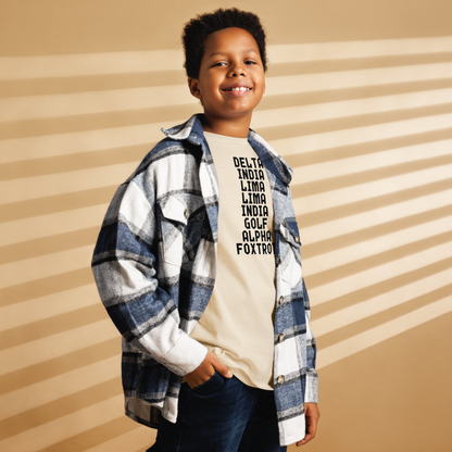 "DILLIGAF" printed on a natural youth classic tee worn by a male also wearing a jacket