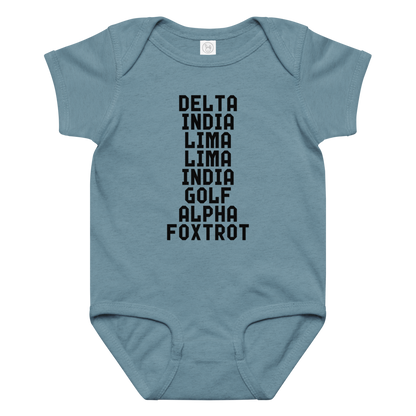 "DILLIGAF" printed on a vintage indigo baby jersey bodysuit laying on a flat surface amongst other clothes