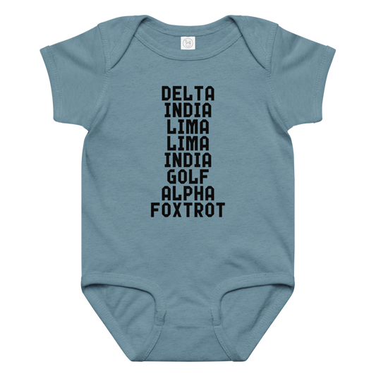 "DILLIGAF" printed on a vintage indigo baby jersey bodysuit laying on a flat surface amongst other clothes