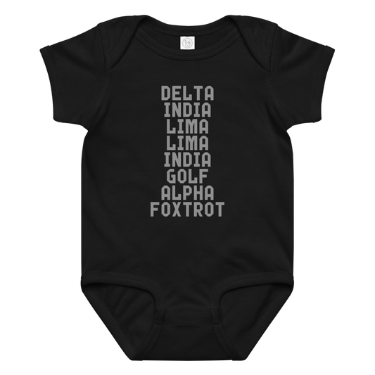 "DILLIGAF" printed on a black baby jersey bodysuit laying on a flat surface amongst other clothes