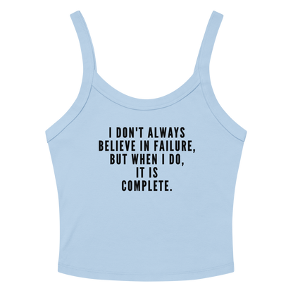 "I don't always believe in failure, but when I do, it is complete." printed on a solid baby blue blend women's micro-rib tanktop laying on a flat surface amongst sunglasses and shorts
