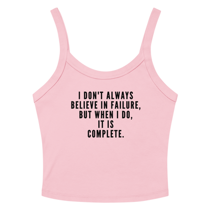 "I don't always believe in failure, but when I do, it is complete." printed on a solid pink blend women's micro-rib tanktop laying on a flat surface amongst sunglasses and shorts