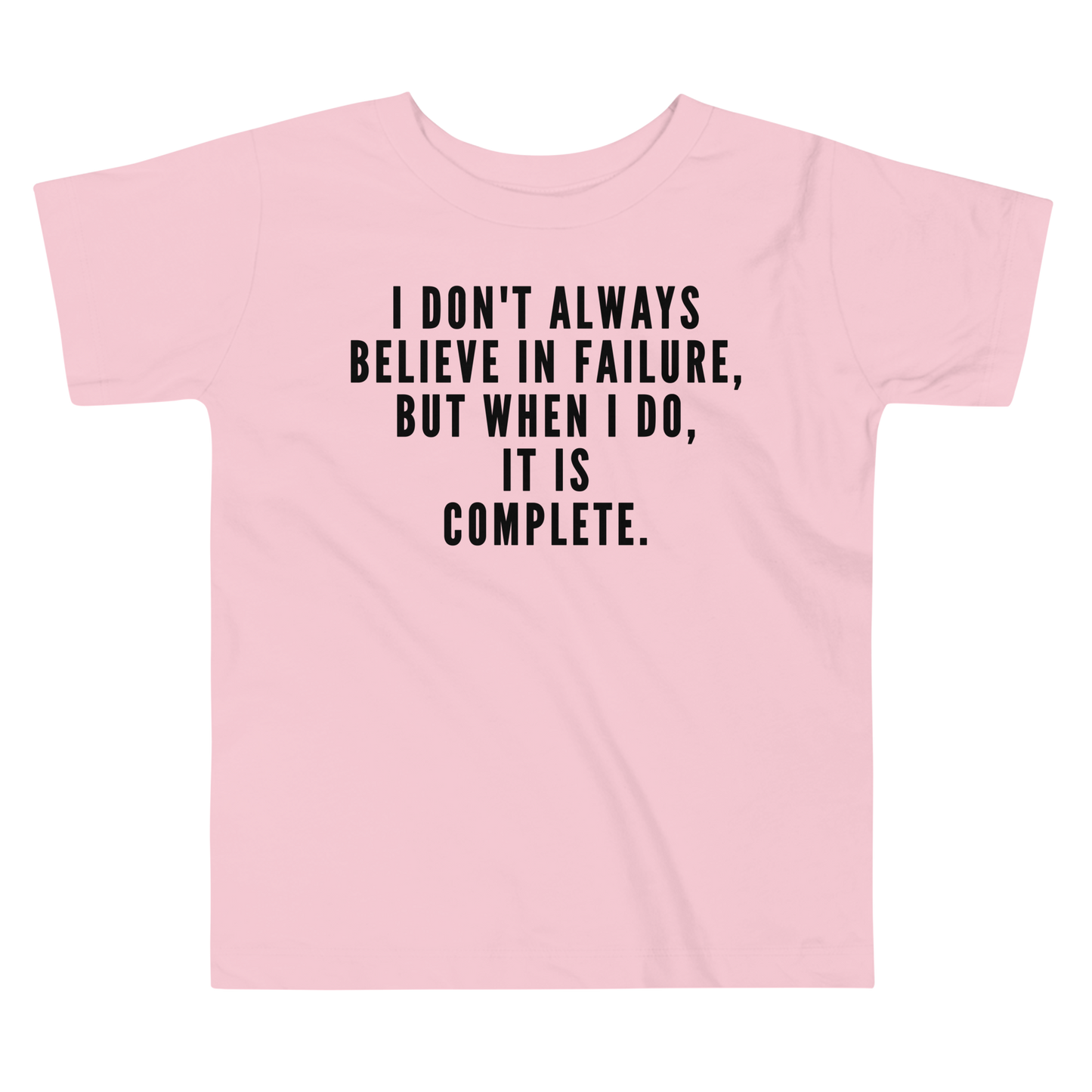 "I don't always believe in failure, but when I do, it is complete." printed on a pink toddler short sleeve tee laying on a flat surface