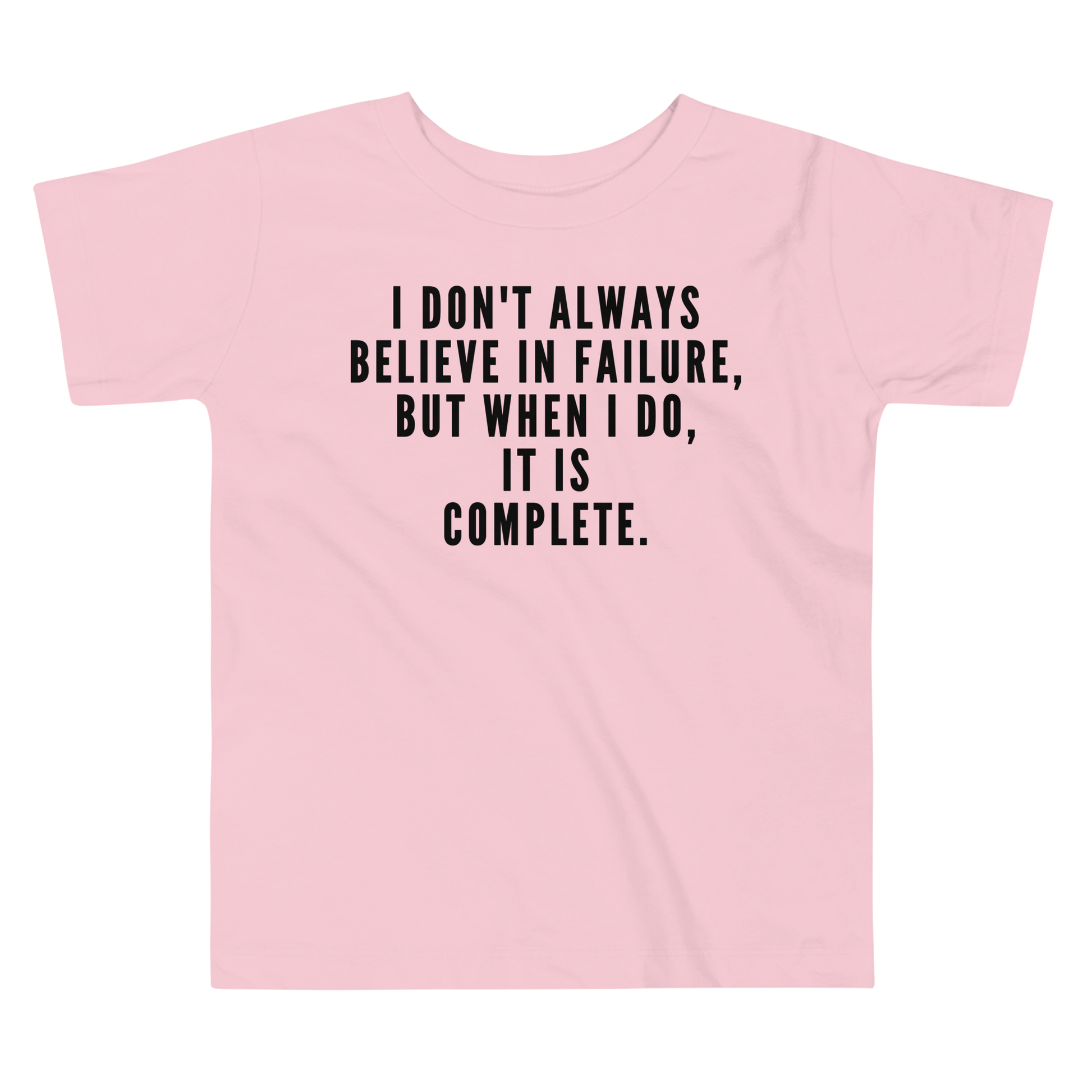 "I don't always believe in failure, but when I do, it is complete." printed on a pink toddler short sleeve tee laying on a flat surface