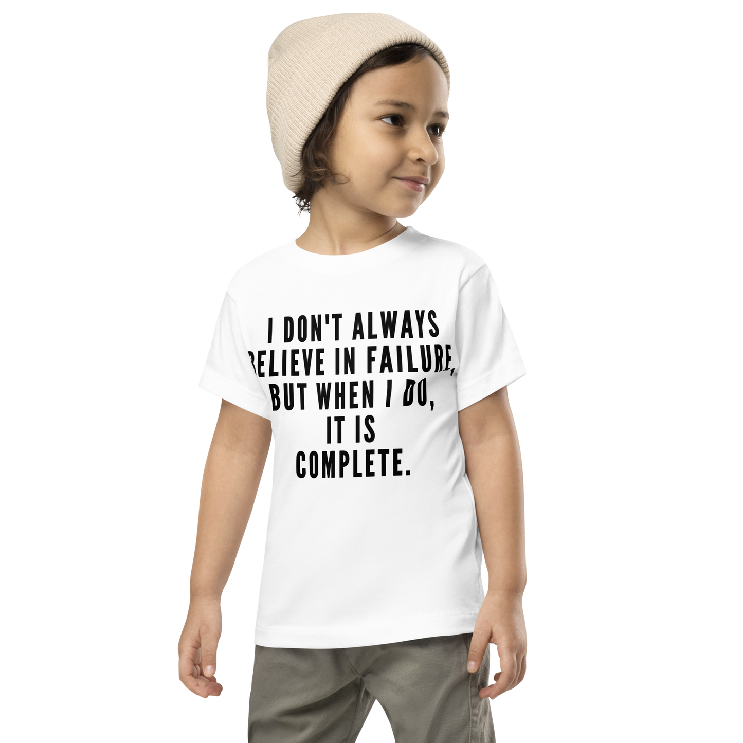 "I don't always believe in failure, but when I do, it is complete." printed on a white toddler short sleeve tee worn by a male wearing a cap