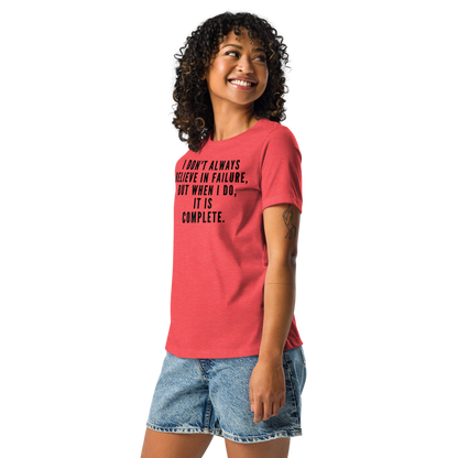 "I don't always believe in failure, but when I do, it is complete." printed on a heather red women's relaxed t-shirt worn by a female